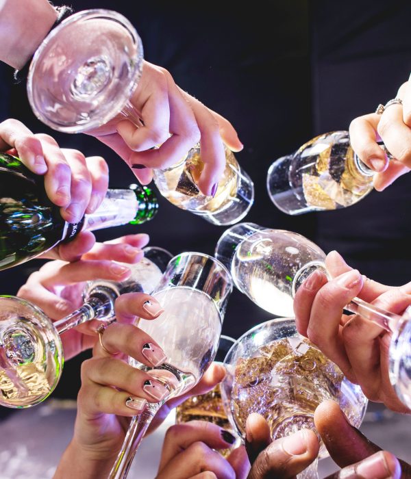 hands-friends-with-wineglasses-scaled.jpg
